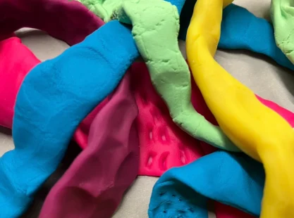 Brightly coloured clay pieces close up.